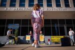 Alejandra Rodriguez, 9, of Key Largo, Fla., watches as college students protest in support of the Department of Education, Thursday, March 20, 2025, outside the department in Washington. 