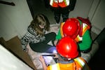 Annabeth Jamieson, age 11, is assisted by volunteers during a Neighborhood Emergency Teams training in Portland, Ore., on Apr. 12, 2025. Jamieson, who was instructed to act as if she had a broken leg, has volunteered as an actor twice before.