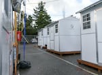 FILE: Sleeping pods at the Arbor Lodge shelter site in North Portland, operated by Do Good Multnomah, Jan. 20, 2022. The facility was purchased in 2020 using federal COVID-19 response funding and features health and housing services for unsheltered people, 12 heated sleeping pods, shower units and beds for 70 people in the main building, 