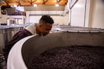 CJ McCollum looks over a vat of grapes at Adelsheim Vineyard. He's collaborating with the Willamette Valley winery to produce his McCollum Heritage 91.