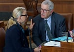 State Sen. Kate Lieber, D-Beaverton and Southwest Portland, left, confers with Sen. Jeff Golden, D-Ashland, at the Oregon Capitol in Salem, March 20, 2023. 