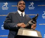 FILE - Heisman Trophy winner Reggie Bush of the University of Southern California smiles while posing for photos after a news conference in New York, Dec. 10, 2005. Bush was reinstated as the 2005 Heisman Trophy winner, Wednesday, April 24, 2024, more than a decade after Southern California returned the award following an NCAA investigation that found he received what were impermissible benefits during his time with the Trojans.