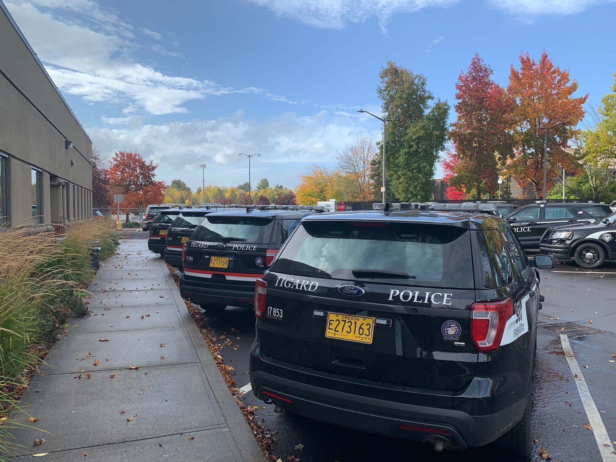 FILE - Several police vehicles are parked in at the Tigard Police Department.