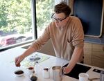 Salt & Straw Co-Founder and Head of Innovation Tyler Malek making strawberry balsamic ice cream at the Salt & Straw Production Facility’s test kitchen in Portland, Ore., on August 8, 2022.