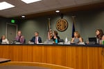 FILE - City councilors attend a city council meeting in Bend, Ore. on July 17, 2024.