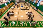 Voters check in and head to voting booths at the Charlestown Boys and Girls Club in Charlestown, Mass.