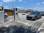 This charging station in Grovetown, Ga., was overcrowded. An electric school bus that was driving on a statewide clean-energy road show needed one charger; another charger was broken.