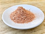 After processing in a blender (or coffee or spice grinder), the onion powder will acquire a pretty pinkish-orange color. Sarah Marshall describes the flavor and aroma as distinctive — deep but not spicy. 