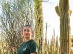 Tania Hernandez, Ph.D. sits for a portrait with saguaro cactus at the Desert Botanical Garden in Phoenix, Arizona on Friday, June 28, 2024. Dr. Hernandez is a New World Succulents Cactus scientist and launched the Saguaro Cactus Census in 2020. Her projects aim to preserve biodiversity of Saguaros across the Sonoran Desert.