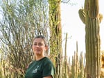 Tania Hernandez, Ph.D. sits for a portrait with saguaro cactus at the Desert Botanical Garden in Phoenix, Arizona on Friday, June 28, 2024. Dr. Hernandez is a New World Succulents Cactus scientist and launched the Saguaro Cactus Census in 2020. Her projects aim to preserve biodiversity of Saguaros across the Sonoran Desert. 