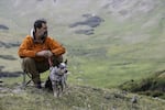 Rob Edward takes a break with his Australian Cattle Dog, Bella Blue, near the top of Old Fall River Road in Rocky Mountain National Park.