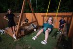 Eileen Lamb, from left, who was diagnosed with autism as an adult, watches over her children, Charlie Lamb and Jude, right, who also have autism, and daughter Billie, Monday, May 12, 2025, in Austin, Texas.