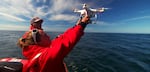 Oregon State University researcher Leigh Torres launches a drone off the Oregon coast to study how whales respond to noise pollution from vessel traffic. The project has funding from the National Marine Fisheries Service Office of Science and Technology Ocean Acoustics Program.