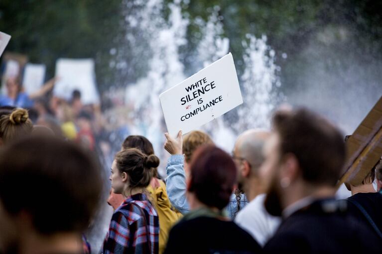 People gathered at the Salmon Street Springs Fountain in Portland begin their march in solidarity with the community of Charlottesville, Virginia, on Aug. 18, 2017.