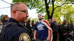 Jeremy Joseph Christian (center wearing American flag), the man accused of a fatal stabbing on the MAX train, attended the April 29 "March for Free Speech" on 82nd Avenue.