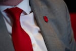 A Portland Metro Chamber rose pin is worn by an audience member.
