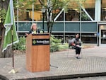 Ann Cudd, left, speaks at Portland State University's faculty and staff convocation in downtown Portland on Sept. 20, 2023.