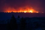 The Bench Fire burns on the Warm Springs Reservation, seen from Culver, Ore., on July 27, 2026.