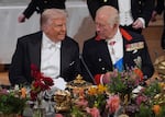 Britain's King Charles, right, and U.S. President Donald Trump speak at a State Banquet in Windsor Castle, England, on day one of U.S. President Donald Trump and First Lady Melania Trump's second state visit to the UK, Sept. 17, 2025.