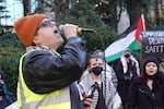 Finn Cunningham leads chanting at a protest against the new administration of President Donald Trump on Jan. 25, 2025. A few dozen protesters gathered for the demonstration at Terry Schrunk Plaza in Portland, Ore.