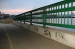 Gang grafitti under Portland Avenue Bridge.