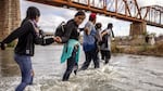 Immigrants from Venezuela crossed the Rio Grande from Mexico into the U.S. last month in Eagle Pass, Texas.