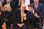 French President Emmanuel Macron, right, talks with US President-elect Donald Trump in Notre Dame Cathedral as France's iconic cathedral is formally reopening its doors for the first time since a devastating fire nearly destroyed the 861-year-old landmark in 2019, Saturday Dec.7, 2024 in Paris ( Ludovic Marin, Pool via AP)