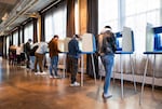 Voters fill out their ballots at a polling place on Election Day, Nov. 4, in Minneapolis, Minn.