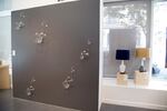 Like sliding a wet finger around a wine glass to make a distinct pitch, Andy Paiko’s "Transference," in collaboration with sound artist Ethan Rose, uses electrical impulses to trigger sound across the rounded glass sculptures.