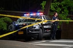 A Portland police officer stands by outside the Multnomah Athletic Club as Portland Police Bureau, Federal Bureau of Investigation and Bureau of Alcohol Tobacco Firearms and Explosives crews work at the scene where a car with an explosive device inside crashed into the MAC, leaving one person dead and several blocks around the area closed, in Portland, Ore., on May 2, 2026.