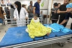 A Palestinian child receives treatment at the Kamal Adwan Hospital after an Israeli airstrike, in Beit Lahiya, in the northern Gaza Strip, on Oct. 19, amid the ongoing conflict between Israel and the Palestinian Hamas militant group.