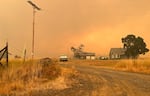 A contributed image of Lisa Sethmann’s home in Friend, Ore., shown on Aug. 11, 2026. Sethmann and her husband have been evacuated from their residence since Sunday and are currently staying in a hotel. Fire crews are on the scene working to protect both her residence and on-site distillery.