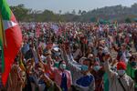 Supporters of Myanmar military wave Myanmar national flags during a rally supporting military coup in Naypyitaw, Myanmar, Thursday, Feb. 4, 2021.