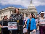 Then-Senator Kamala Harris (D-Calif.) takes part in a protest at the U.S. Capitol in 2018 against then-President Donald Trump's threats to Central American asylum seekers to separate their children from their parents along the southwest border, preventing migrants from crossing into the United States.