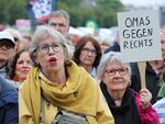 Demonstrators with signs reading "Grandmas against the far-right" protest against right-wing extremism and racism at the Deutzer Werft shipyard in Cologne, Germany, June 1.