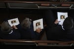 Guests hold programs during a tribute service for former first lady Rosalynn Carter at Glenn Memorial Church at Emory University in Atlanta, Georgia, on November 28, 2023.