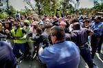 University of Southern California protesters push and shove University Public Safety officers as tempers get heated during a pro-Palestinian occupation on the University of Southern California campus Wednesday, April 24, 2024 in Los Angeles.
