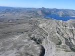 An aerial view of Spirit Lake and the pumice plain that holds it in.