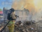 In this photo provided by the Ukrainian Emergency Service, a firefighter puts out a fire at ruined private houses following Russia's air raid in the Donetsk region, Ukraine, Monday, April 28, 2025.