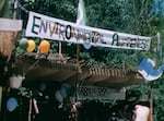 In this screenshot of an archive video from July 1977, a banner promoting environmental stewardship on display at the Oregon Country Fair. “I think the fair had a big part of bringing that consciousness to the mainstream,” said event manger Mark Malaska. 