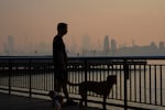 The New York City skyline is seen through a cover of wildfire smoke in Jersey City, N.J., Friday, July 17, 2026.