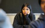 Ali of the Class of 25 story sits with her head in her hand during English class at David Douglas High School in Portland on Sept. 6, 2023. 