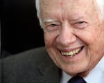 FILE - Former U.S. President Jimmy Carter smiles during a meeting with Sudanese officials at the national elections commission in Khartoum, Sudan, April 9, 2010.