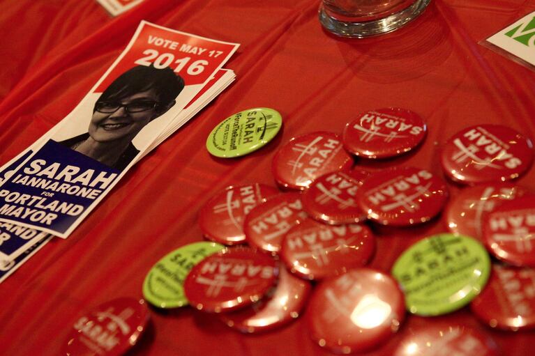 Buttons and stickers from mayoral candidate Sarah Iannarone's results watch party. Iannarone finished third in the race to become Portland's next mayor.