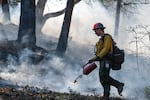 Firefighters undertake a prescribed burn at the Upper Applegate Watershed near Medford, Ore., on April 27, 2023. Such burns can help reduce the risk of large wildfires.