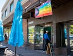 Ben Hirsch walks into Turtle Island Coffee Shop in Bend Ore., on Jun. 7, 2024.