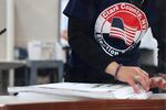 A Clark County Election Department worker sorts ballots on Nov. 9, 2022, in North Las Vegas, Nev. Nearly 60% of the state's county voting officials are new since 2020, according to a new report.