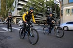 FILE - Police on bicycles patrol downtown Portland in this Oct. 6, 2023, file photo. One of the central city task force's recommendations for downtown is more police.
