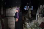 Raeda Abu Ali, 60 looks at the charred remains of her home in the Refugee camp in Jenin, Palestine on September 18, 2024. The Israeli army raided her home and used it as a position for 4 days because of the views from the top floors. Effectively holding the Abu Ali family household hostage, where 26 members of the extended family were living, including 8 children, spread over three floors.The Army left the home severely damaged including breaking down doors and walls so they could walk through the complex including the main floor apartment which was left completely charred and covered in debris after a rear was blasted through with a gas canister, leaving a large gaping hole. The trauma of this event has left the children in an agitated state.