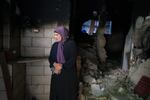 Raeda Abu Ali, 60 looks at the charred remains of her home in the Refugee camp in Jenin, Palestine on September 18, 2024.  The Israeli army raided her home and used it as a position for 4 days because of the views from the top floors. Effectively holding the Abu Ali family household hostage, where 26 members of the extended family were living, including 8 children, spread over three floors.The Army left the home severely damaged including breaking down doors and walls so they could walk through the complex including the main floor apartment which was left completely charred and covered in debris after a rear was blasted through with a gas canister, leaving a large gaping hole.  The trauma of this event has left the children in an agitated state. 